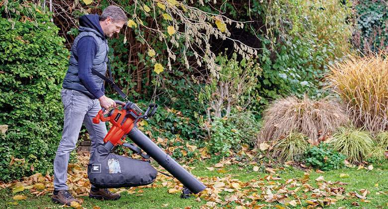 man working with a cordless leaf vacuum