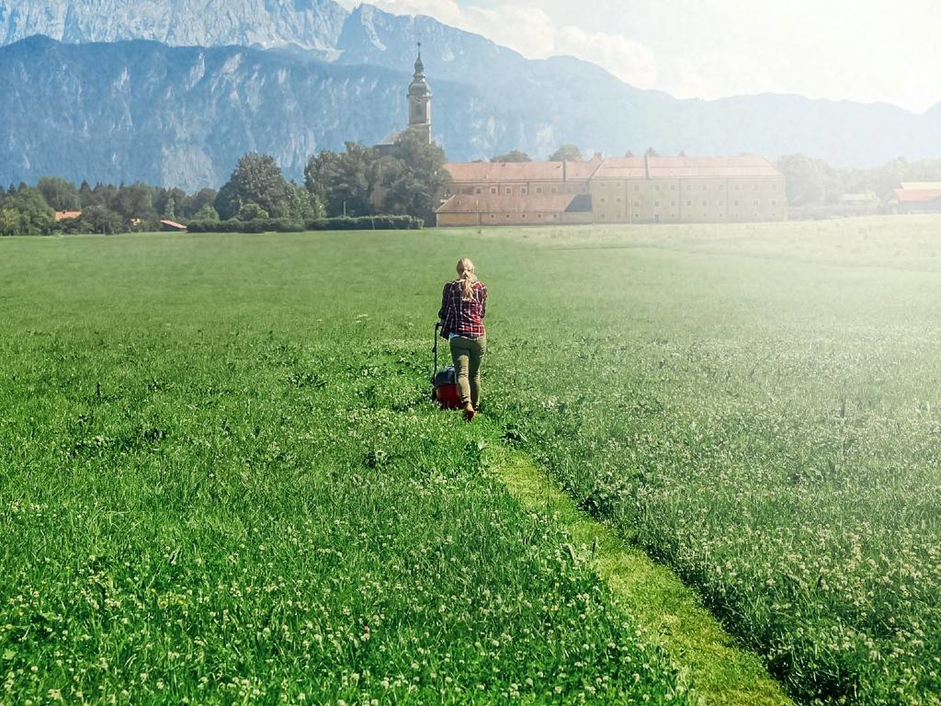 Woman mowing the lawn